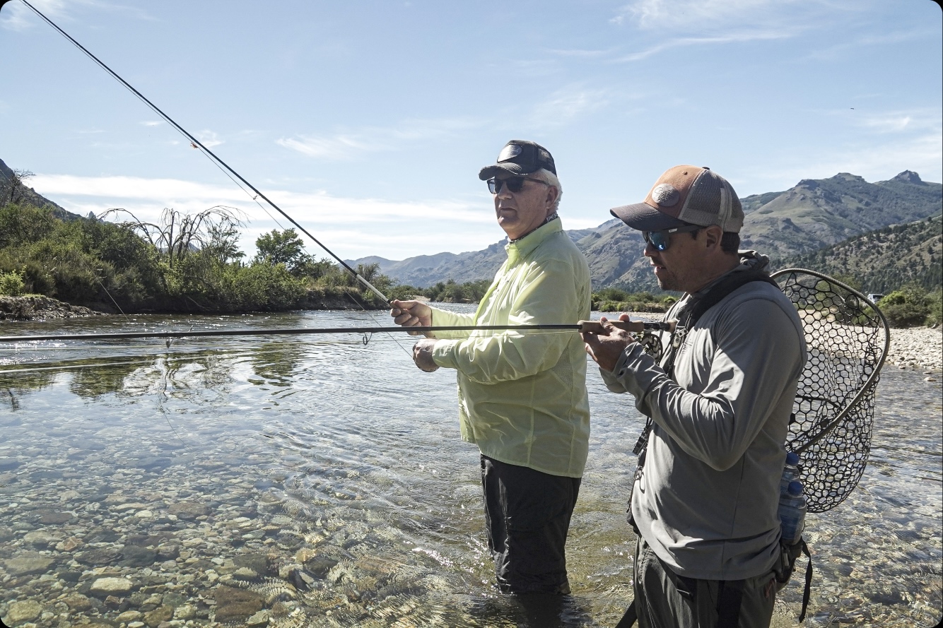 Angler casting mid-river