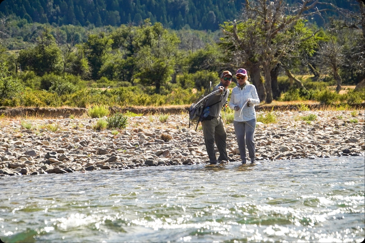 Anglers wading a shallow run