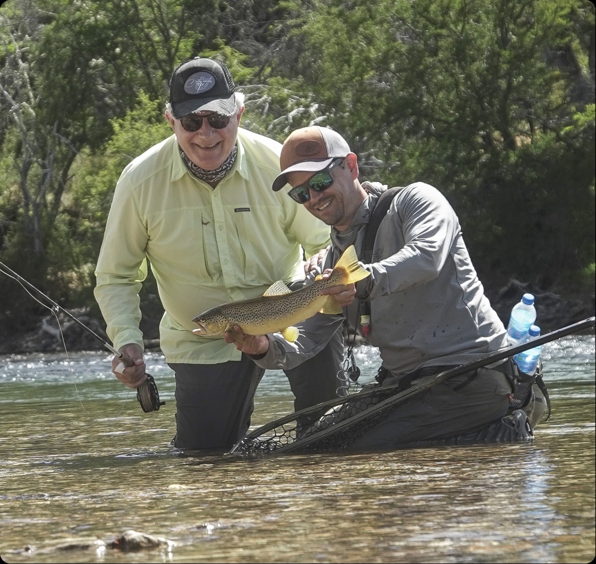 Guide releasing a trout