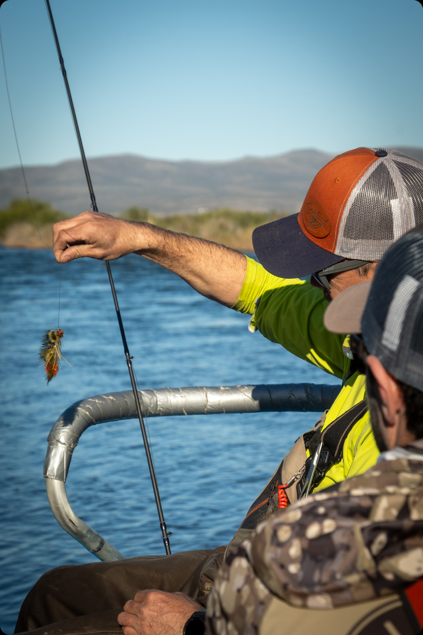 Angler playing a fish with a bent rod