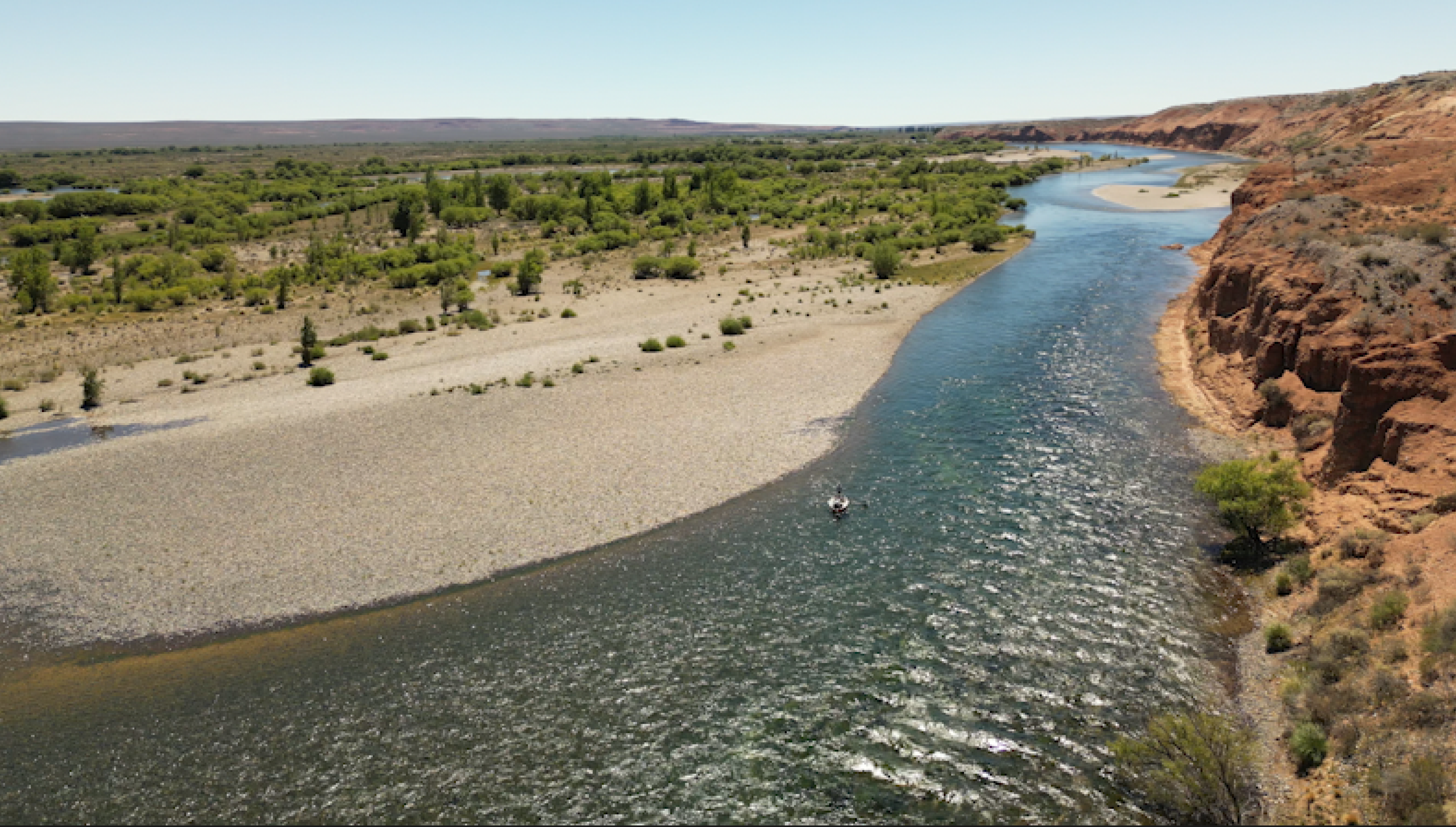 Aerial view of a Patagonian river winding through canyon country