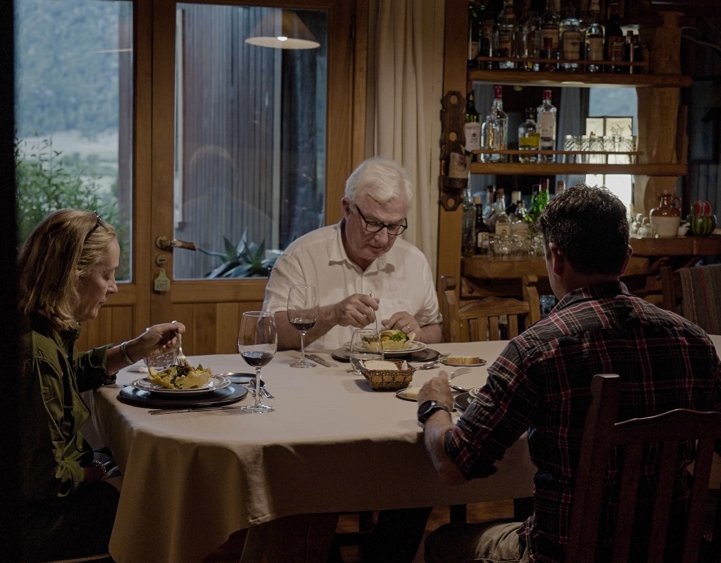 Guests sharing dinner in a lodge dining room