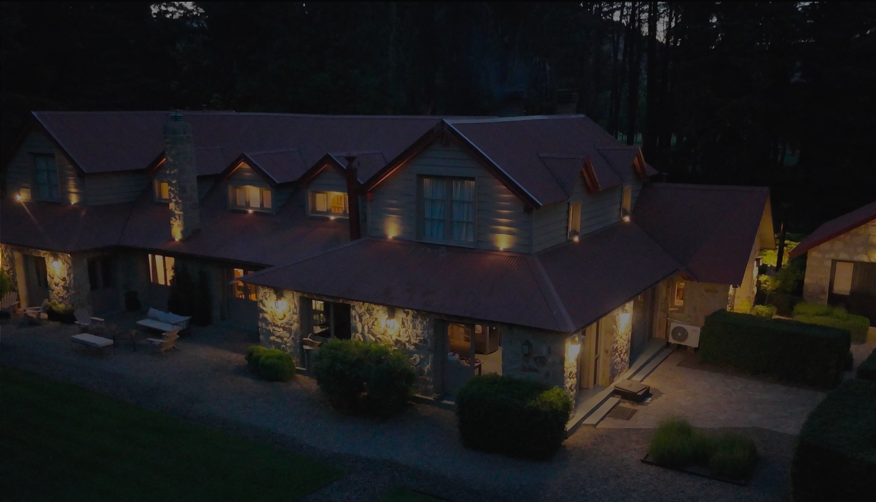 A Patagonian lodge glowing at dusk