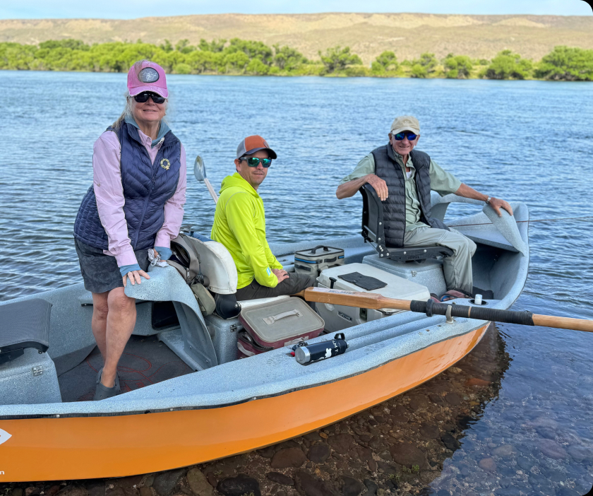 Anglers in a drift boat on the river